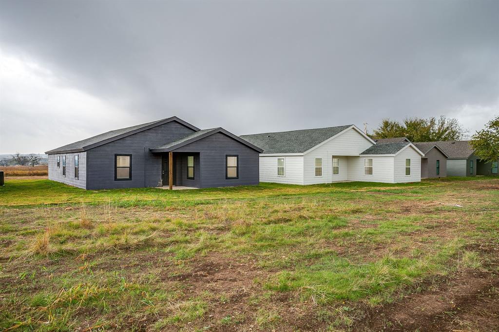122 Kentucky Street Walnut Springs, TX 76690 - Photo 18 of 18 a house view with a outdoor space