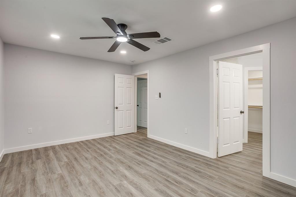122 Kentucky Street Walnut Springs, TX 76690 - Photo 9 of 18 a view of an empty room and wooden floor