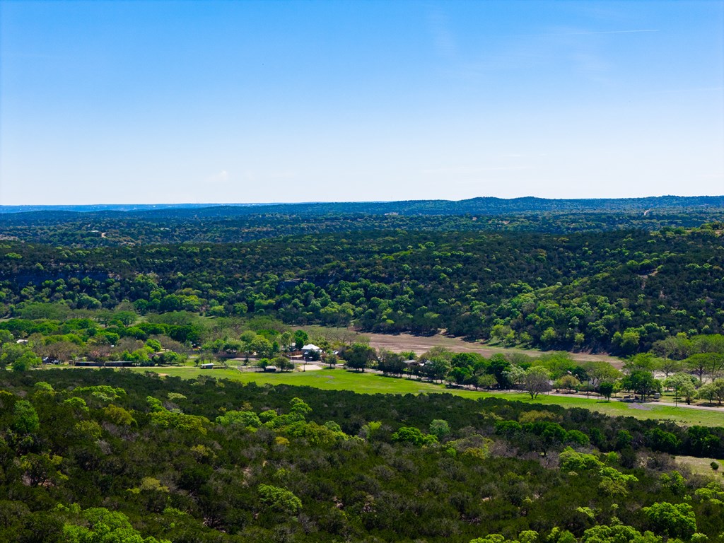 0 Pawnee Path Hunt, TX 78024 - Photo 25 of 32 a view of a city with lush green forest
