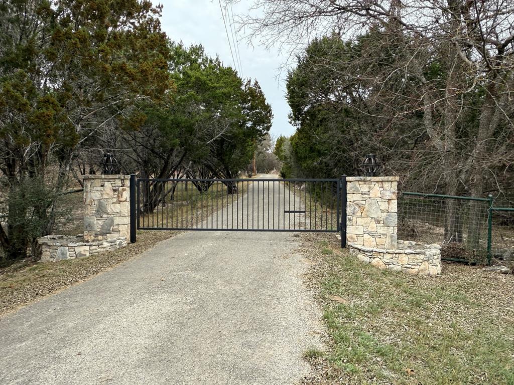 0 Pawnee Path Hunt, TX 78024 - Photo 9 of 32 a sign board with yard in the back