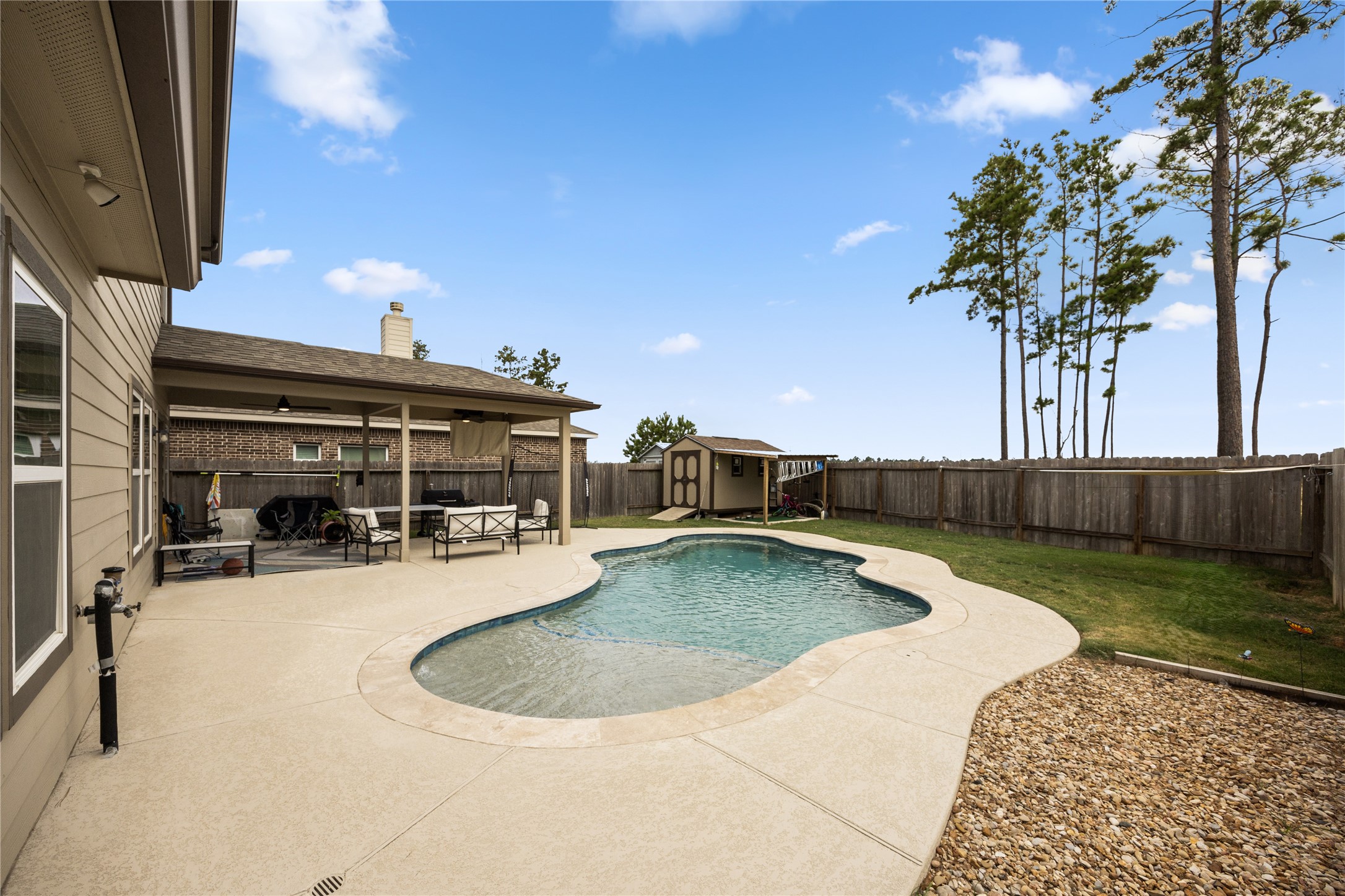 20272 Torrey Pines Lane Cleveland, TX 77327 - Photo 13 of 34 swimming pool view with seating space