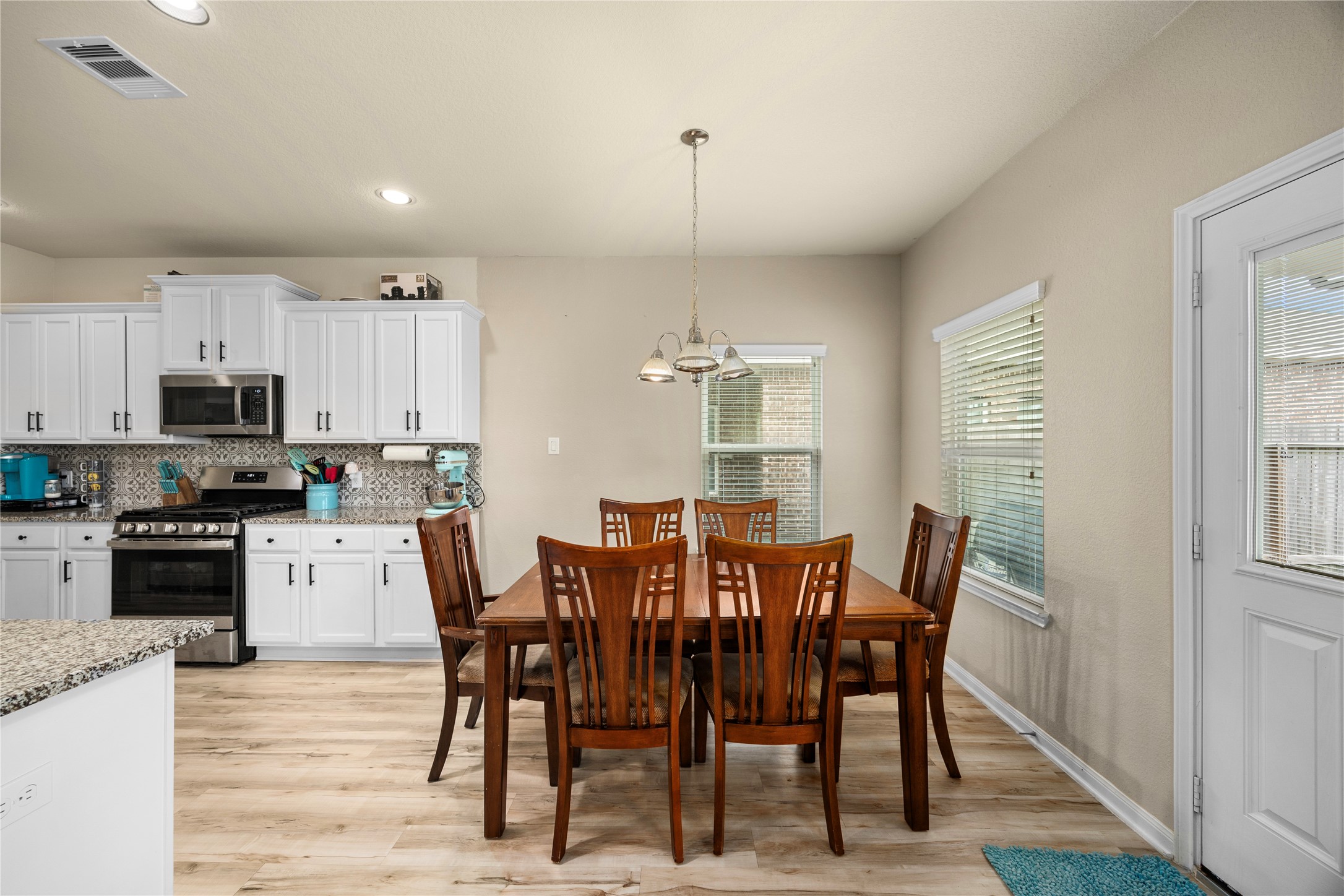 20272 Torrey Pines Lane Cleveland, TX 77327 - Photo 16 of 34 a view of a dining room with furniture window and wooden floor