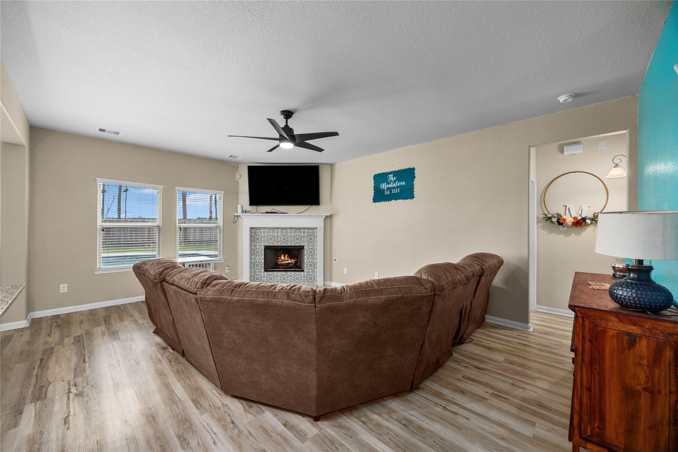 20272 Torrey Pines Lane Cleveland, TX 77327 - Photo 18 of 34 a living room with furniture and a fireplace