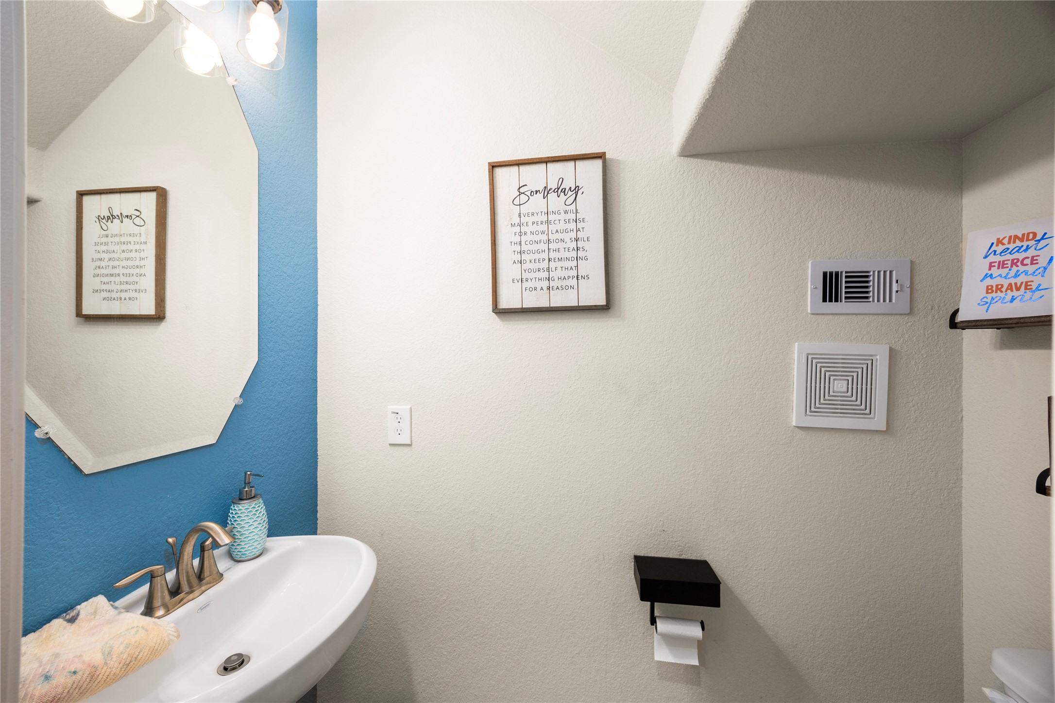 20272 Torrey Pines Lane Cleveland, TX 77327 - Photo 25 of 34 a bathroom with a toilet a sink and mirror