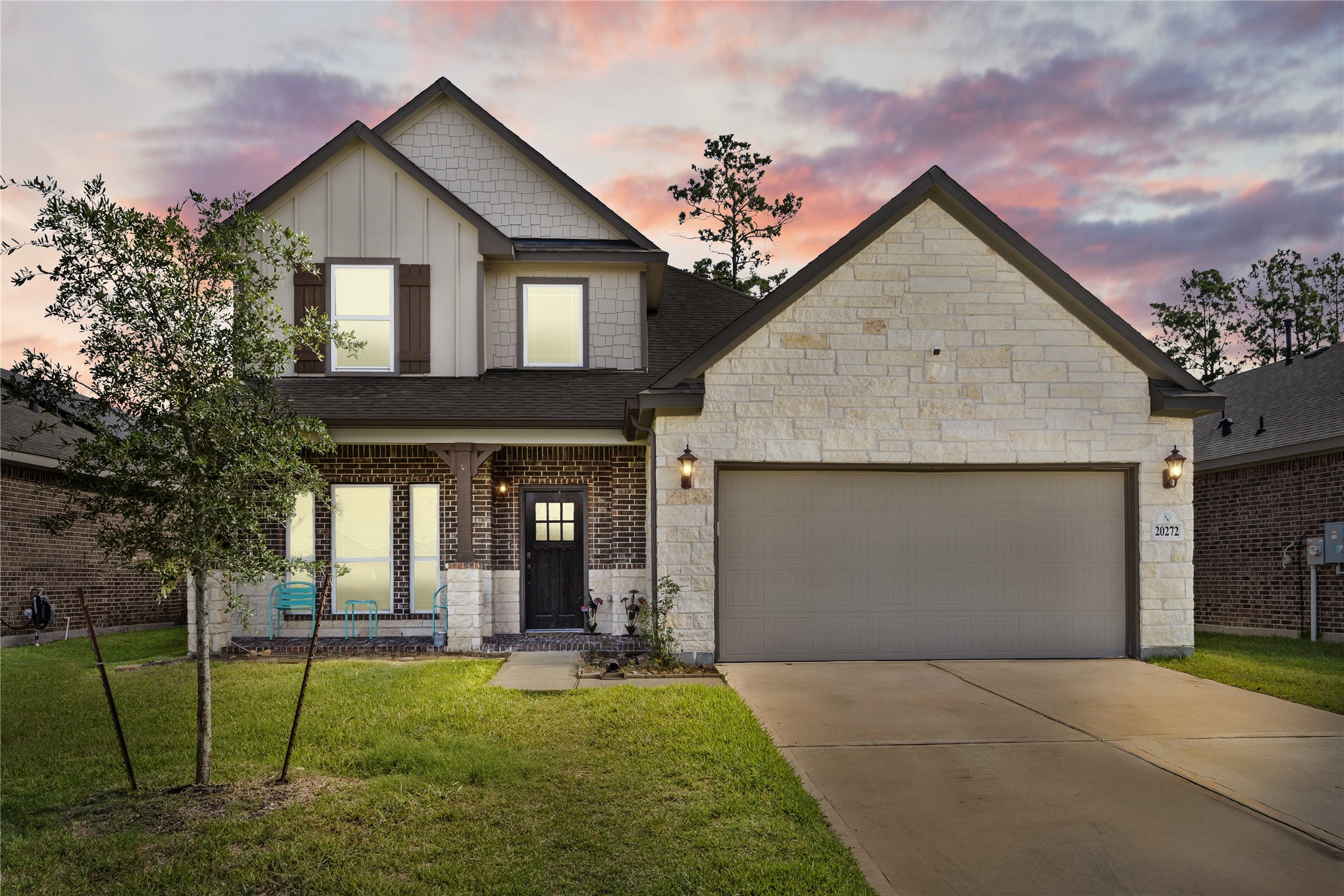 20272 Torrey Pines Lane Cleveland, TX 77327 - Photo 3 of 34 a front view of a house with a garden and plants