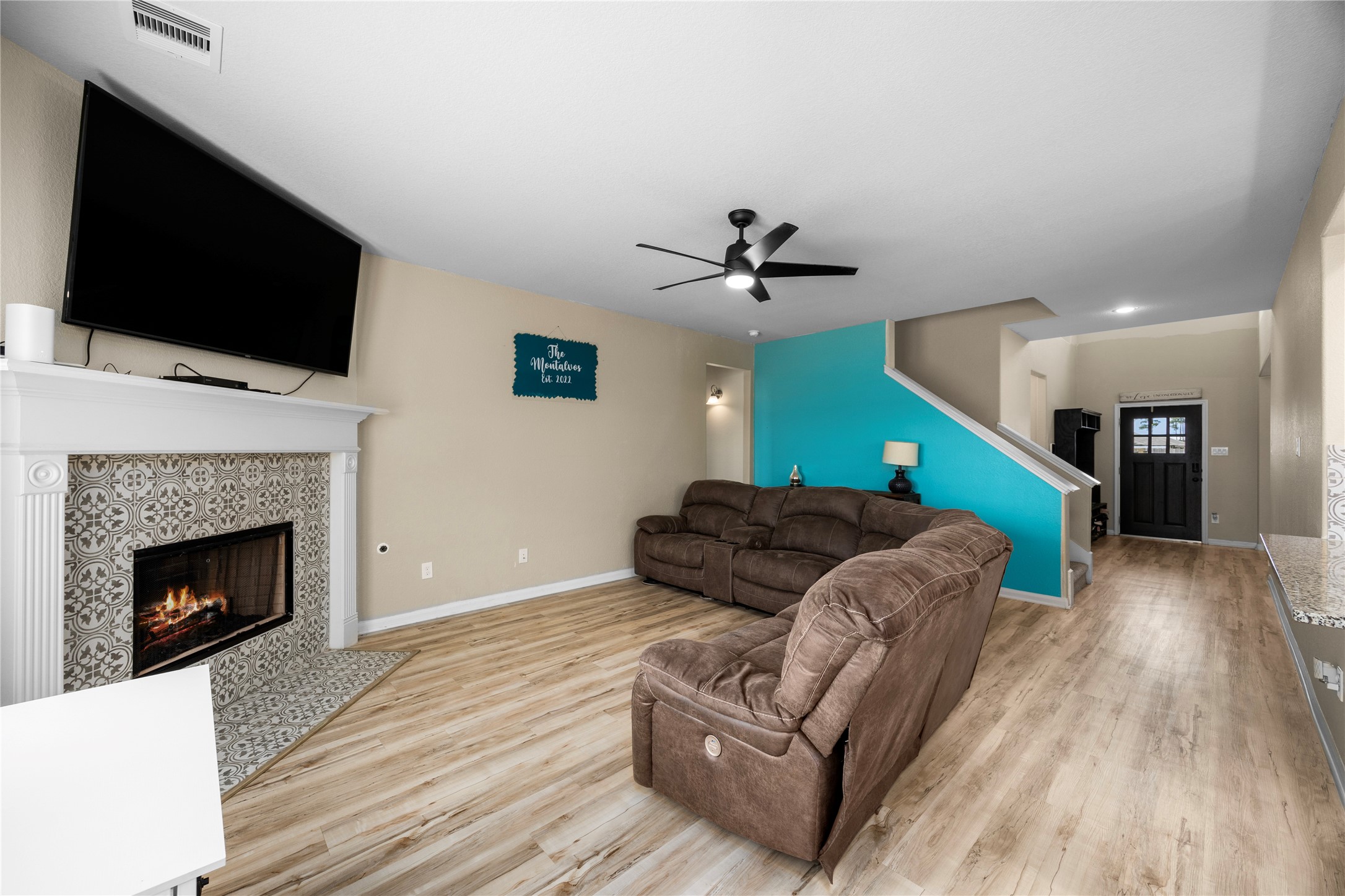 20272 Torrey Pines Lane Cleveland, TX 77327 - Photo 4 of 34 a living room with furniture and a fireplace