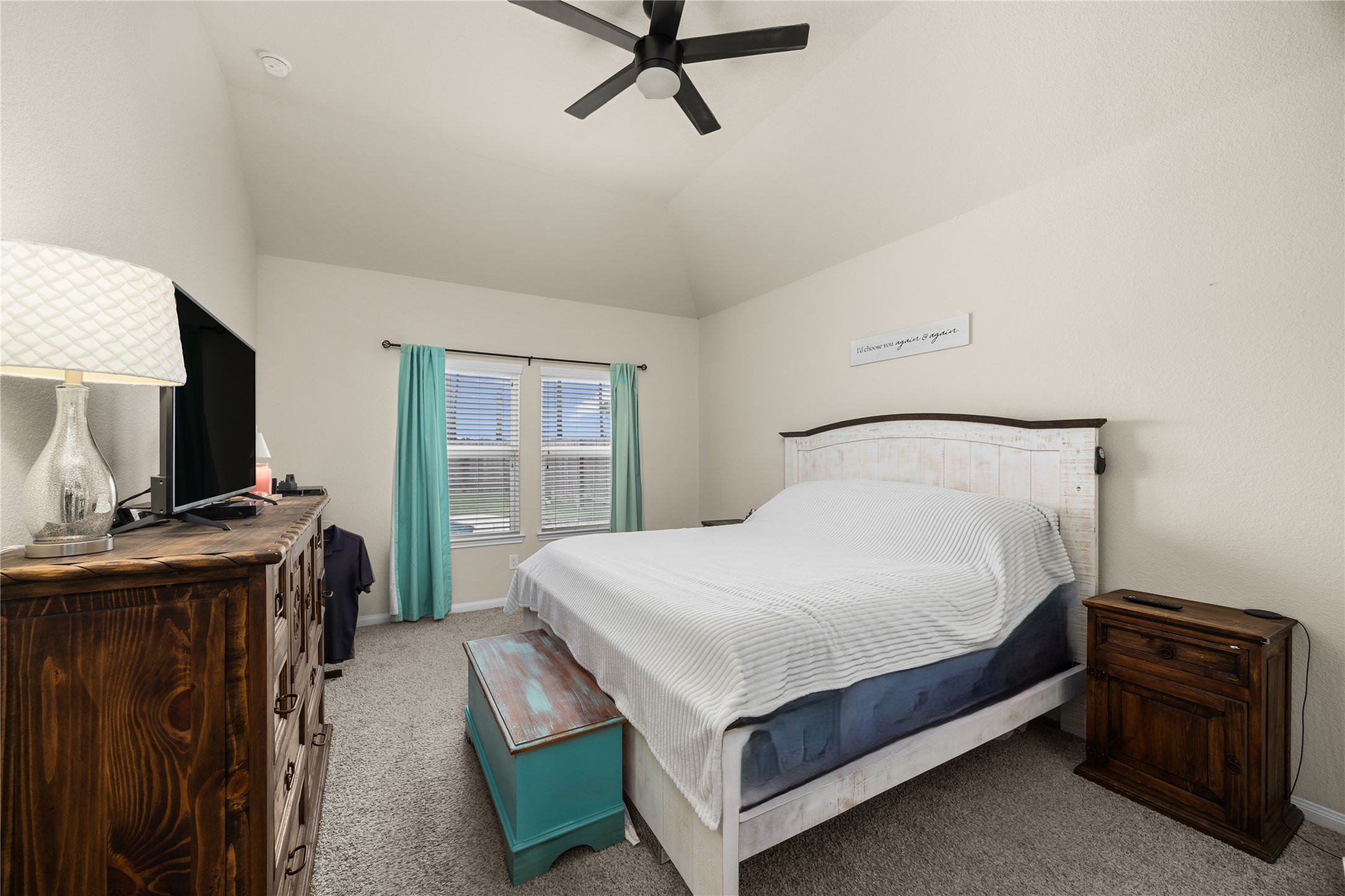 20272 Torrey Pines Lane Cleveland, TX 77327 - Photo 6 of 34 a bedroom with a bed and a flat tv screen on the dresser