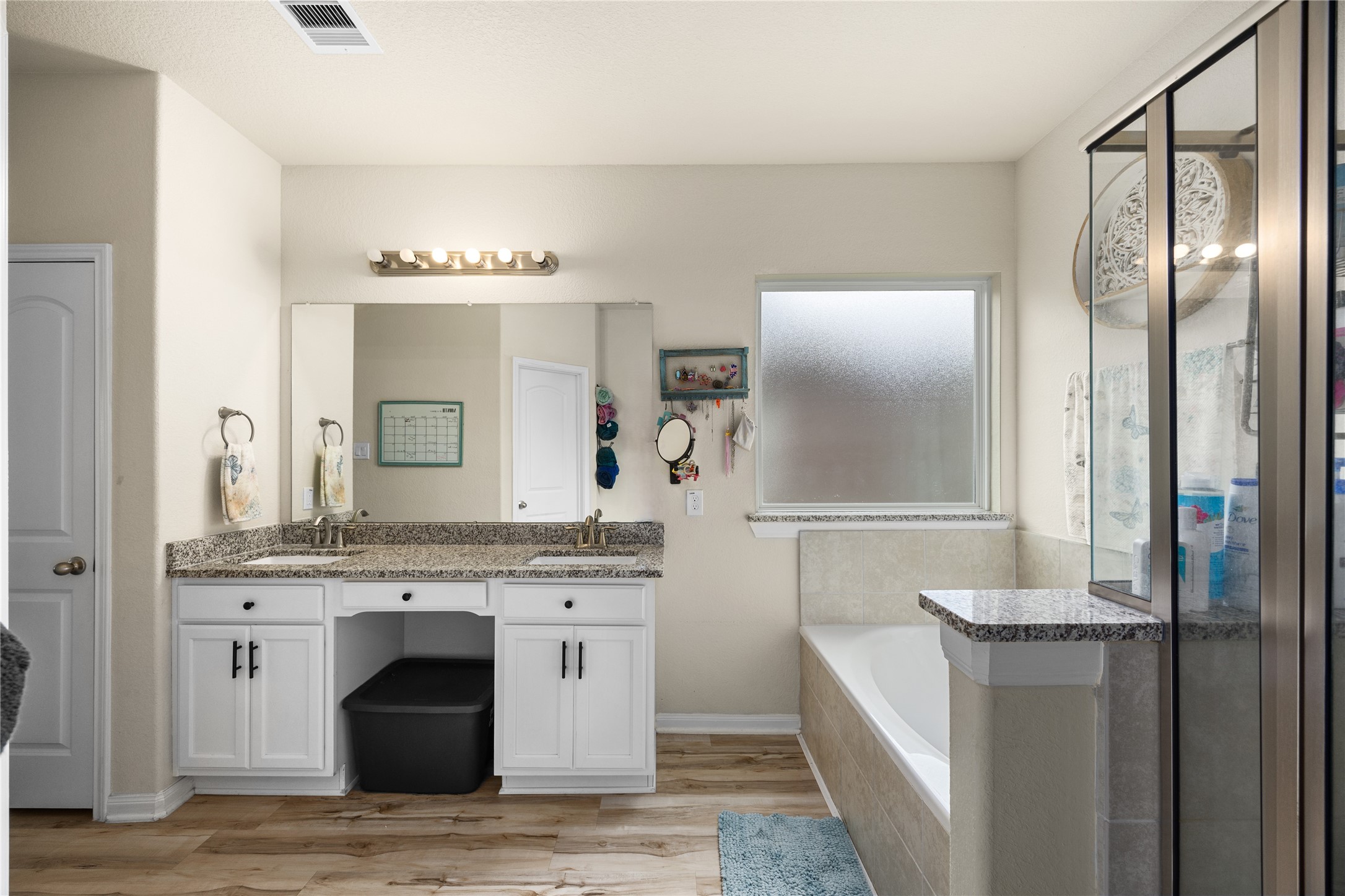 20272 Torrey Pines Lane Cleveland, TX 77327 - Photo 8 of 34 a spacious bathroom with a granite countertop sink and a mirror