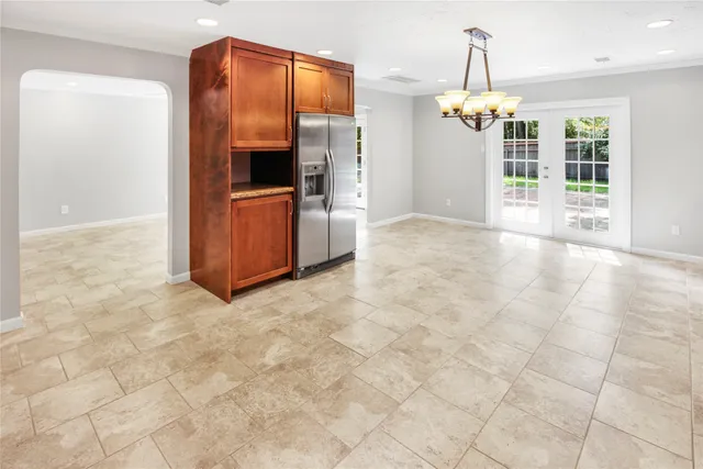 a kitchen with stainless steel appliances granite countertop a sink and cabinets