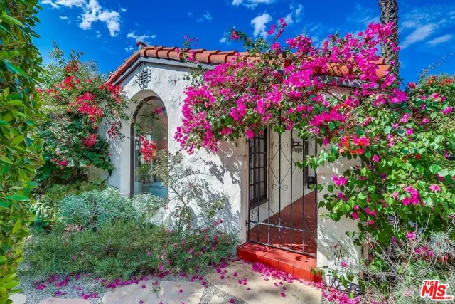 a front view of a house with yard