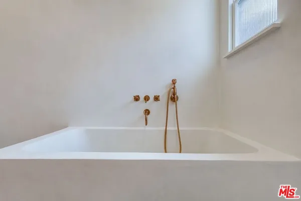a view of a backyard with potted plants