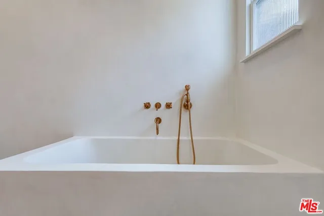 a view of a backyard with potted plants
