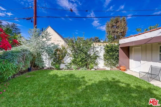 a view of path along with flower pots