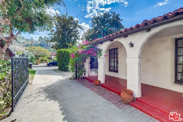 front view of a house with a garden
