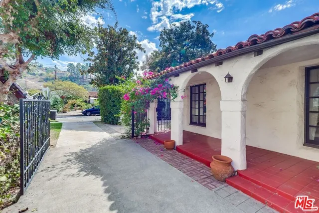 front view of a house with a garden