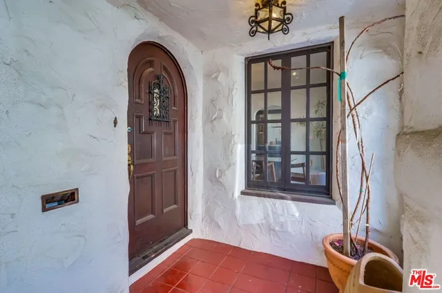 a living room with furniture a window and a fireplace