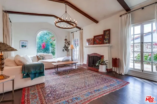 a view of a backyard with couches and a fire pit