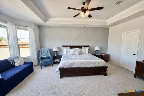 a bed room with a bed and a window