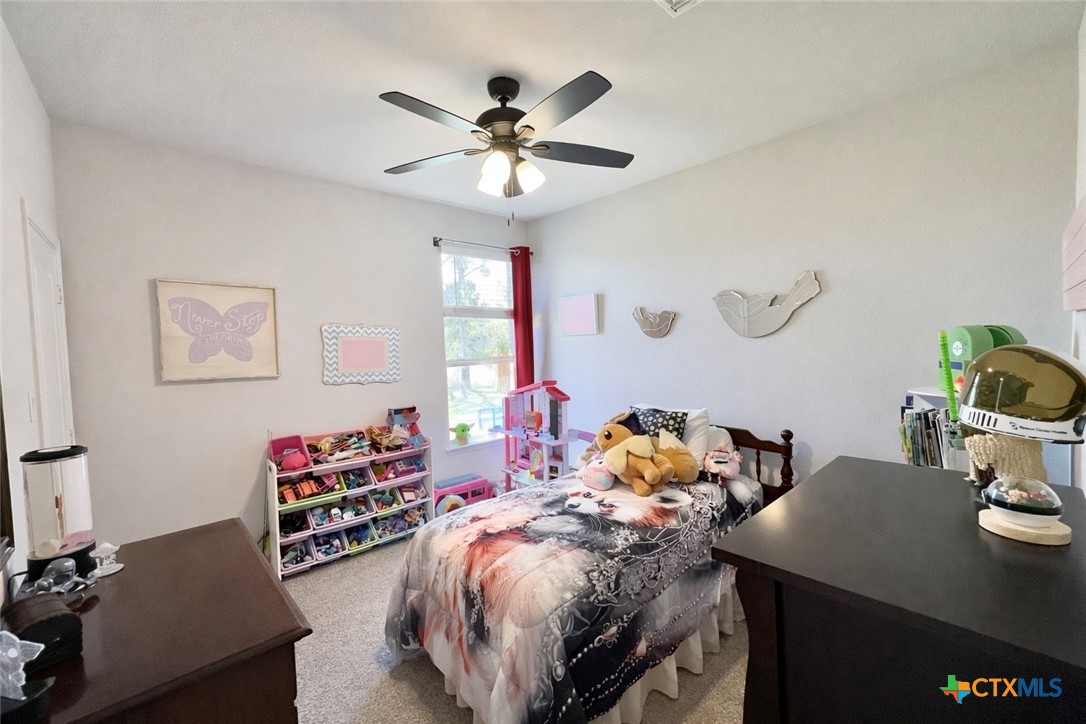 1201 Roma Street Harker Heights, TX 76548 - Photo 21 of 33 a bedroom with a bed and a chandelier