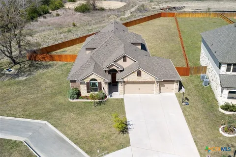 an aerial view of a house with swimming pool