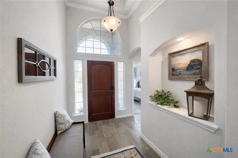 a kitchen with stainless steel appliances granite countertop a refrigerator stove microwave and sink