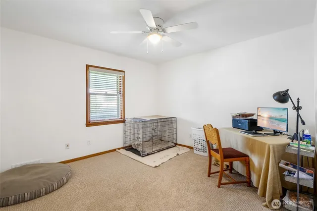 a workspace with furniture and a window