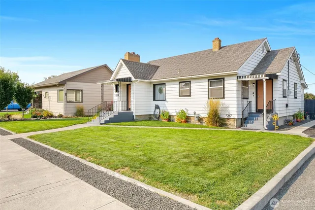a front view of house with yard and green space