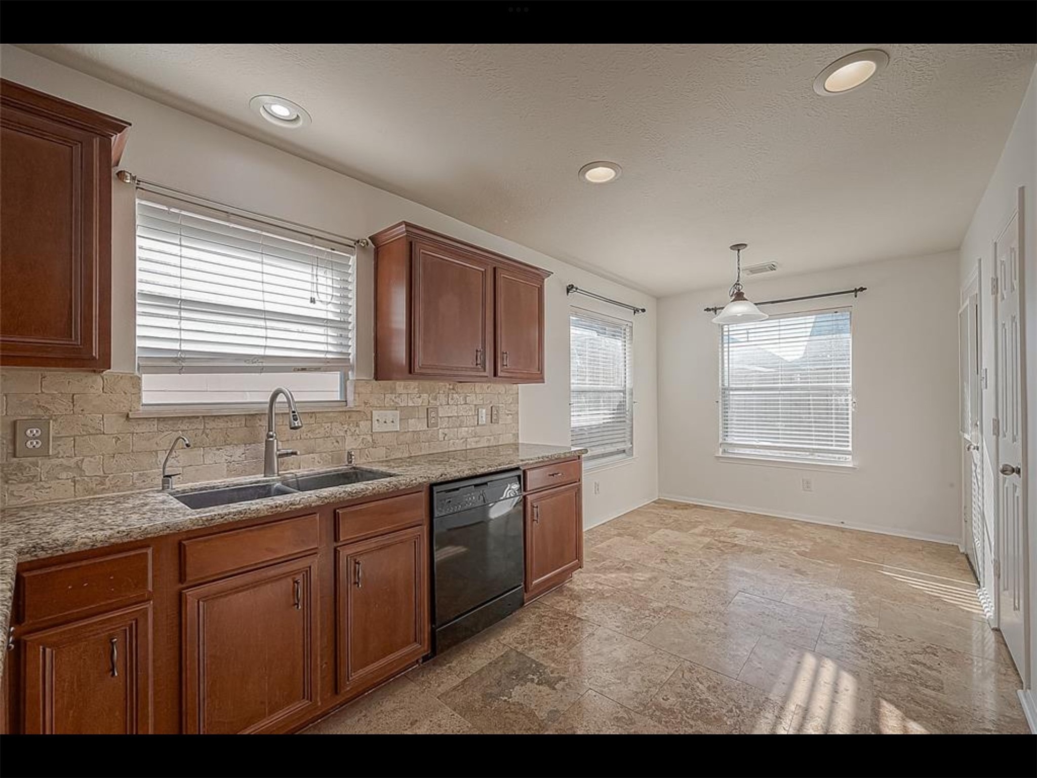 10819 Waterfern Court Houston, TX 77064 - Photo 12 of 37 a kitchen with sink and window