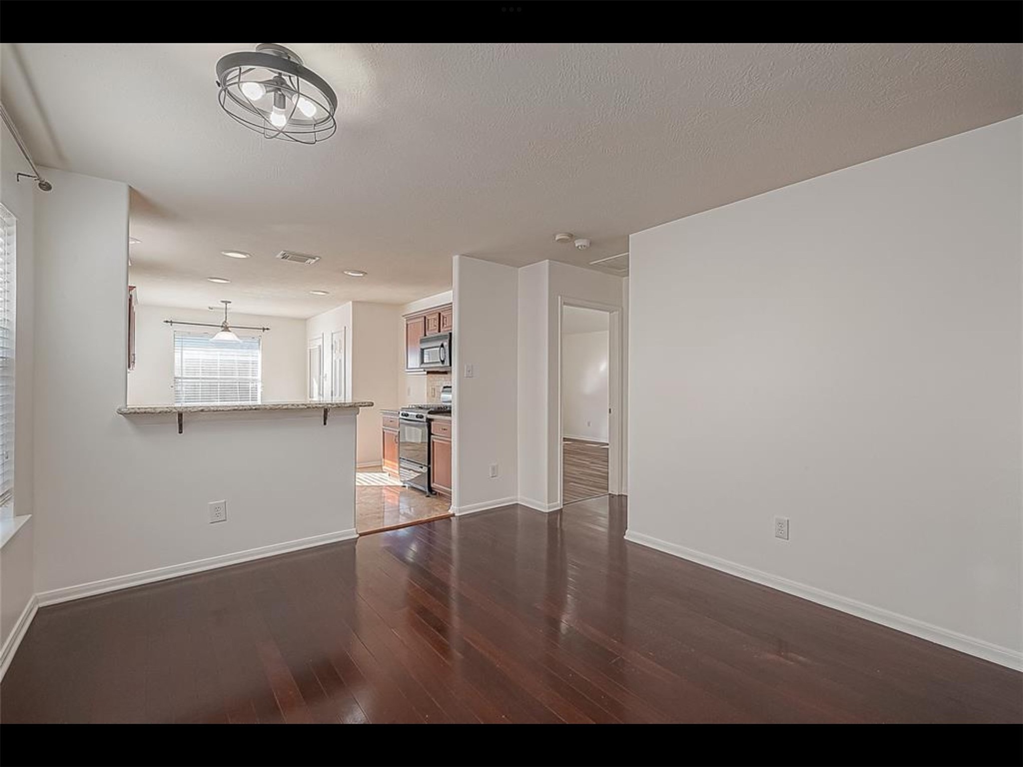 10819 Waterfern Court Houston, TX 77064 - Photo 9 of 37 a view of empty room with wooden floor