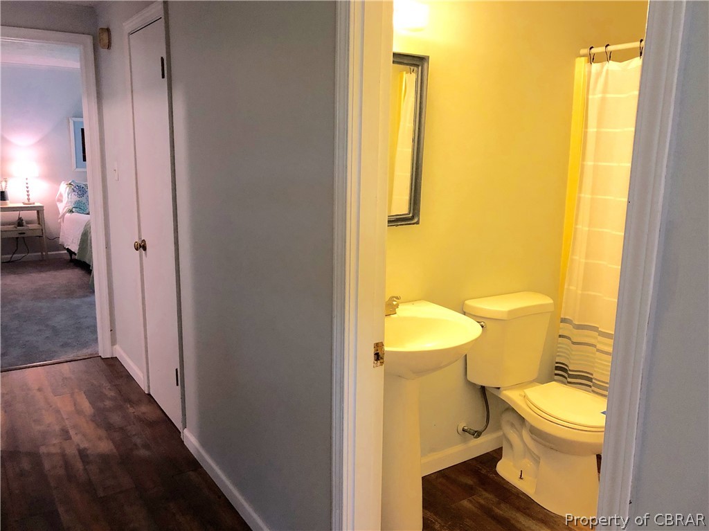 962 Ottoman Ferry Road Lancaster, VA 22503 - Photo 15 of 24 a bathroom with a toilet and a shower