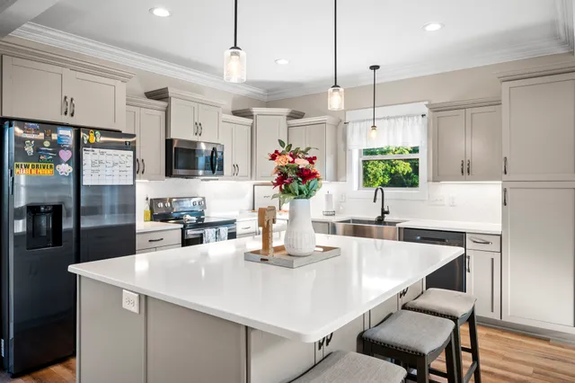 a bathroom with a sink a toilet and a window
