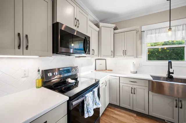 a bedroom with a bed and a flat screen television