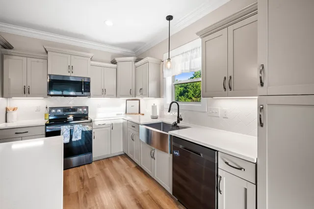 a bedroom with furniture and wooden floor