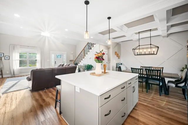 a bedroom that has a bed and a chandelier