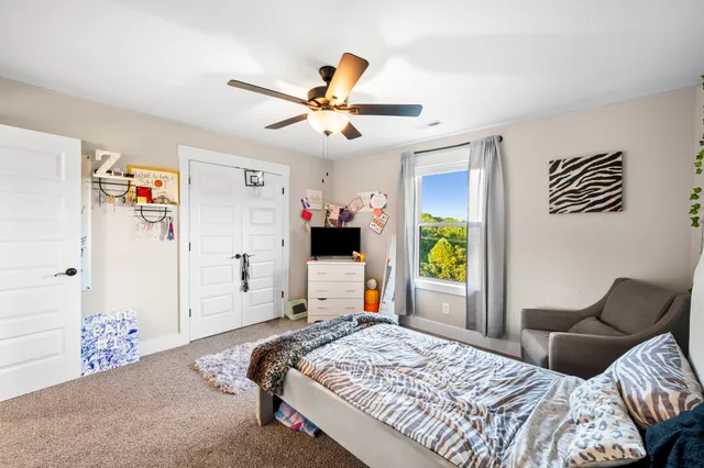 a view of a swimming pool with a yard