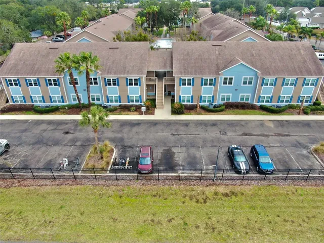 a aerial view of a house with swimming pool and a yard