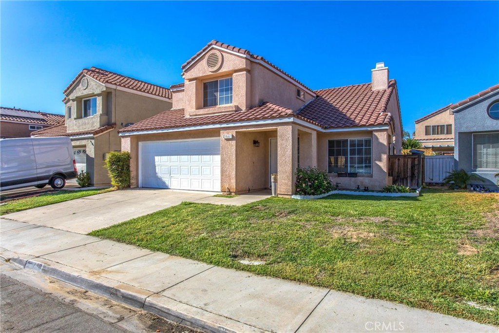 15778 Firethorn Road Fontana, CA 92337 - Photo 1 of 1 a front view of a house with a garden