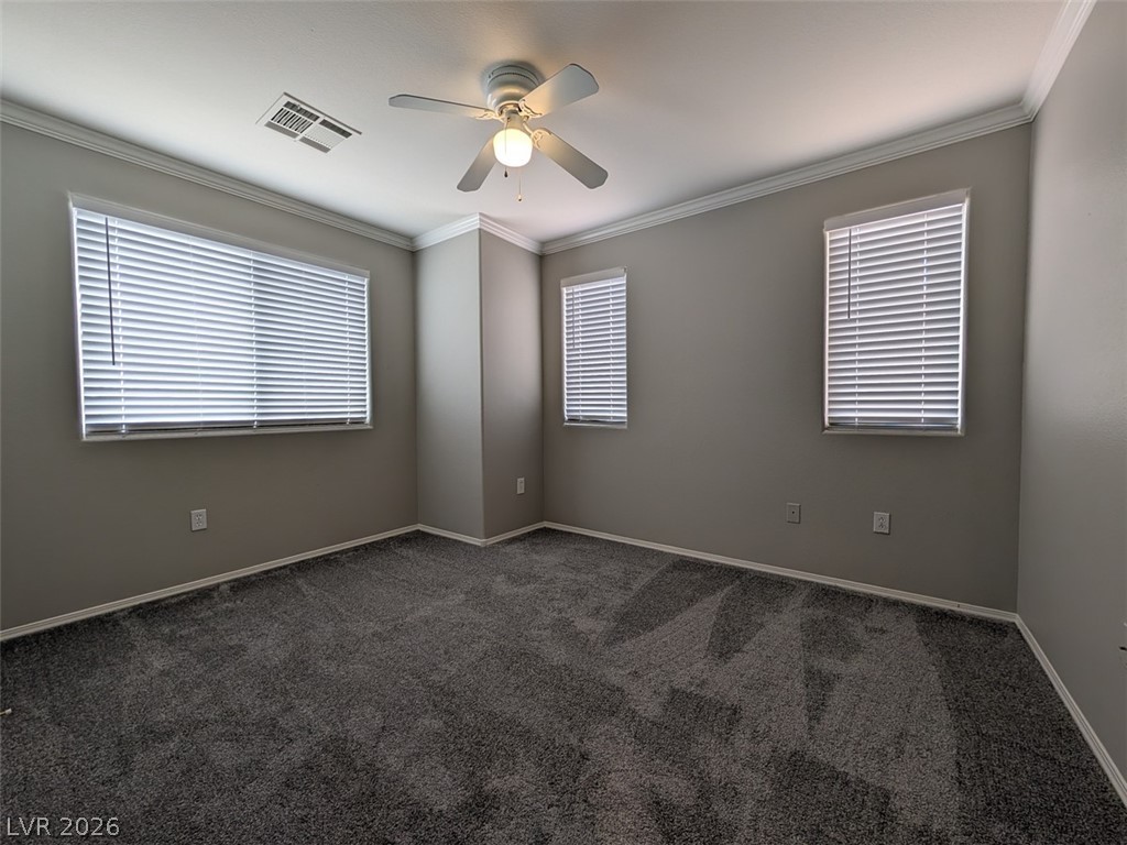 10308 Faustine Avenue Las Vegas, NV 89129 - Photo 15 of 28 A spacious bedroom awaits with plush carpeting and natural light from multiple windows.
