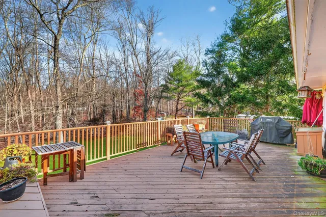 a view of a table and chairs on the roof deck