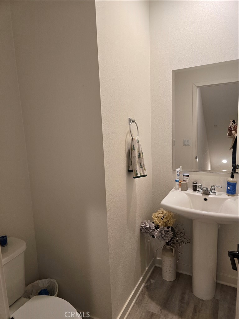10901 Montauk Lane Stanton, CA 90680 - Photo 14 of 21 a bathroom with a toilet sink and mirror