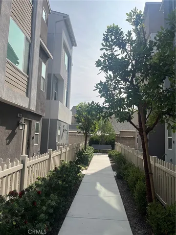 a view of a pathway with house on both side