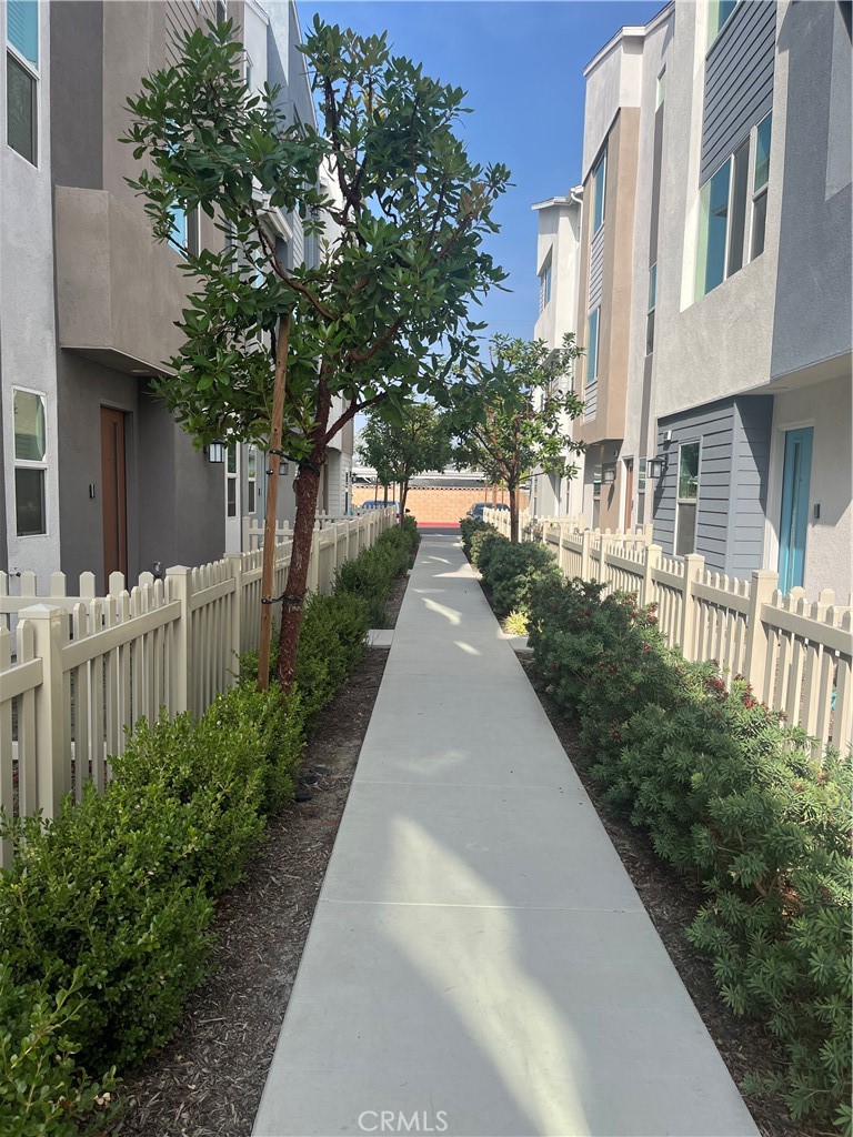 10901 Montauk Lane Stanton, CA 90680 - Photo 20 of 21 a view of a pathway with house on both side