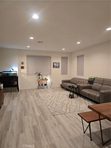 a living room with furniture and a table