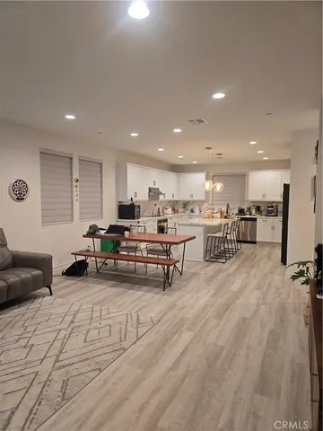 a living room with furniture and a table