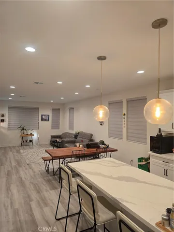 a kitchen with a table and chairs in it