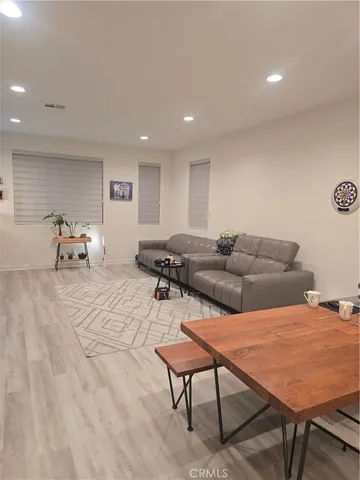 a living room with furniture and a table