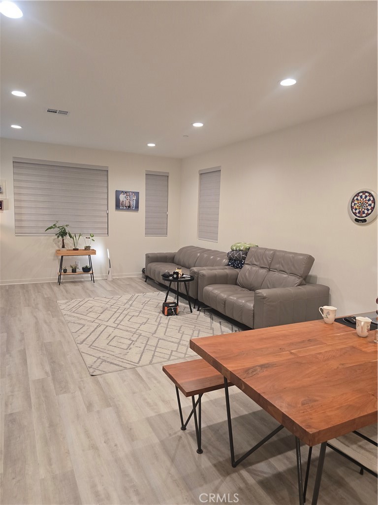 10901 Montauk Lane Stanton, CA 90680 - Photo 7 of 21 a living room with furniture and a table