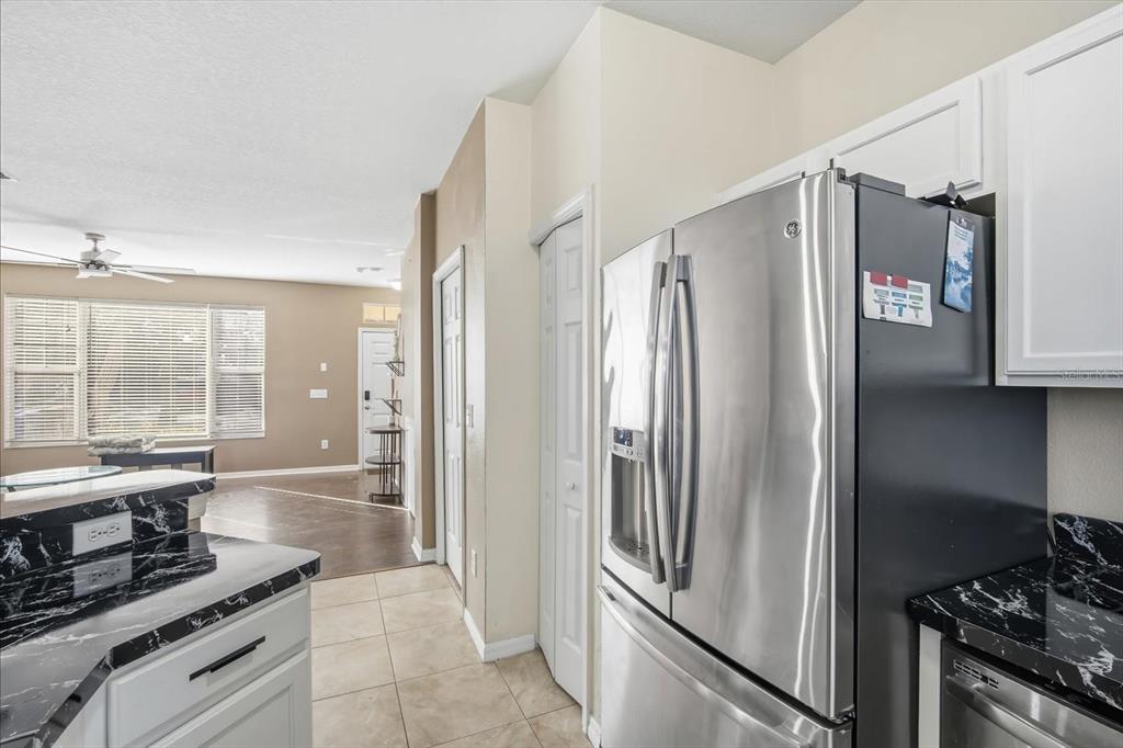 11008 Black Swan Court Seffner, FL 33584 - Photo 12 of 32 a kitchen with stainless steel appliances a refrigerator and a stove