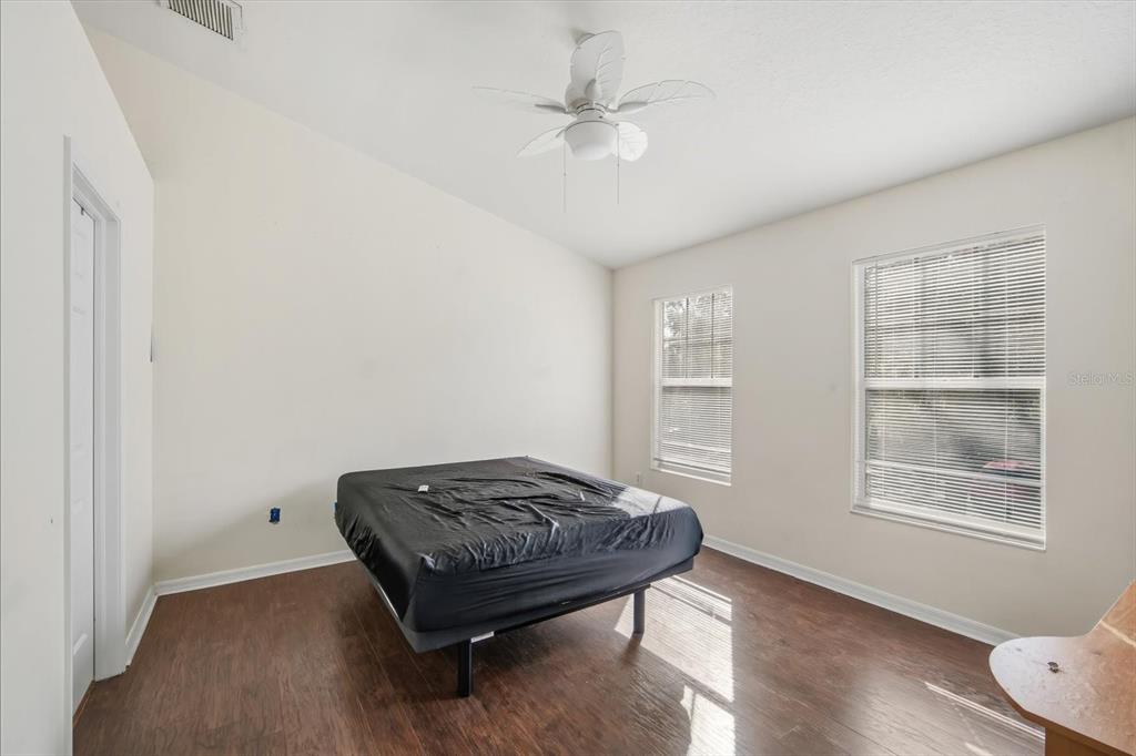 11008 Black Swan Court Seffner, FL 33584 - Photo 14 of 32 a living room with a bed furniture and a window
