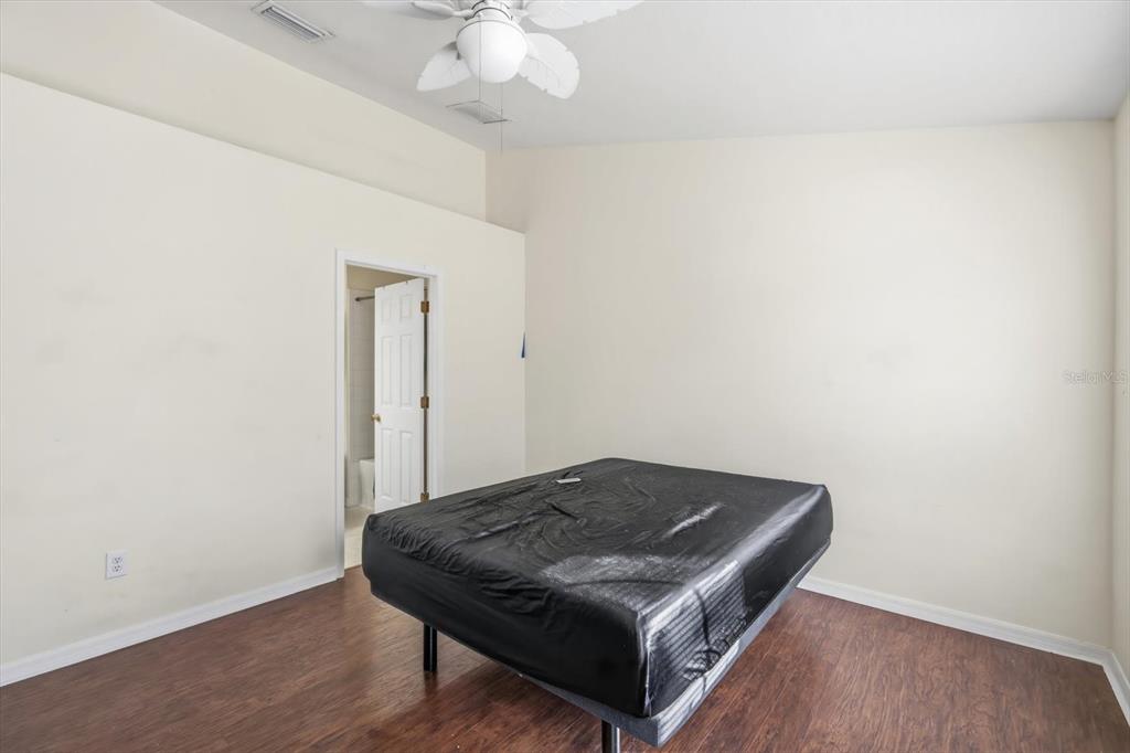 11008 Black Swan Court Seffner, FL 33584 - Photo 15 of 32 a living room with a table and a chandelier
